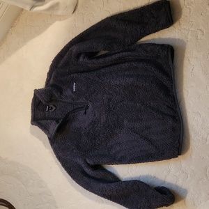 Patagonia half zip.  Fuzzy.  Size M. Slight Elastic bottom.
